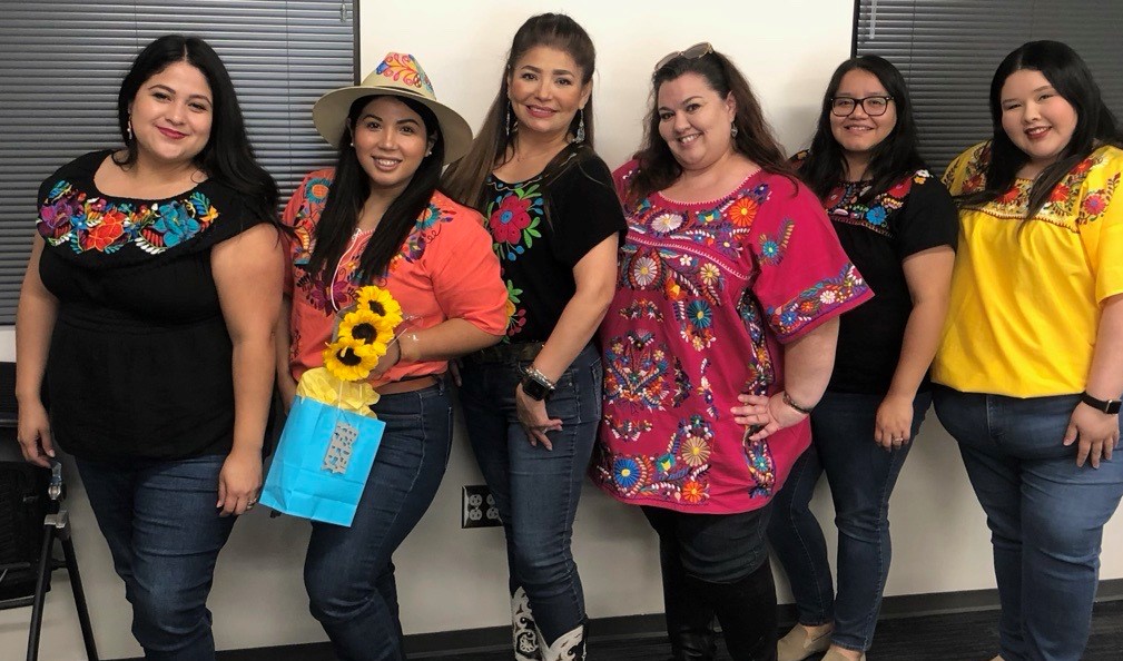 Group of six ProBAR staff wear traditional embroidered blouses in honor of Hispanic Heritage Month.